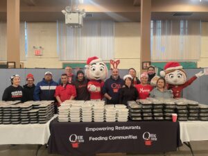 December 2023 - Mr. Met Mrs. Met, Ralph Trionfo of Hi5.NYC with volunteers and Jonathan Forgash of Queens Together at Holiday Event in New York City 